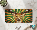 stag portrait vanity plate on marble surface — warm amber forest green decorative deer plate