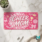 cheer mom vanity plate on marble surface — hot pink pom-pom decorative license plate