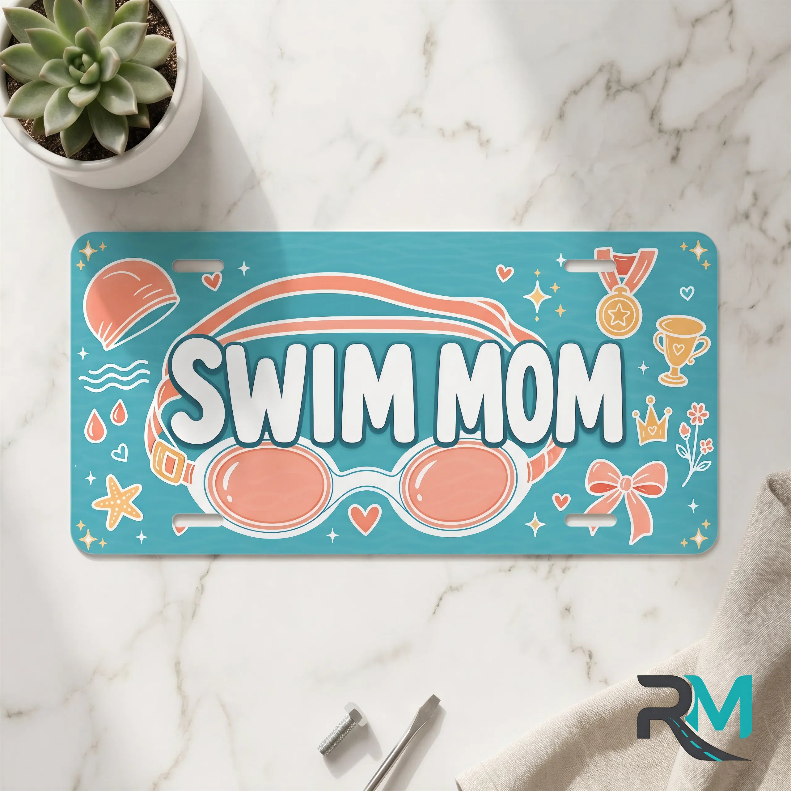 swim mom vanity plate on marble surface — teal coral goggles decorative license plate