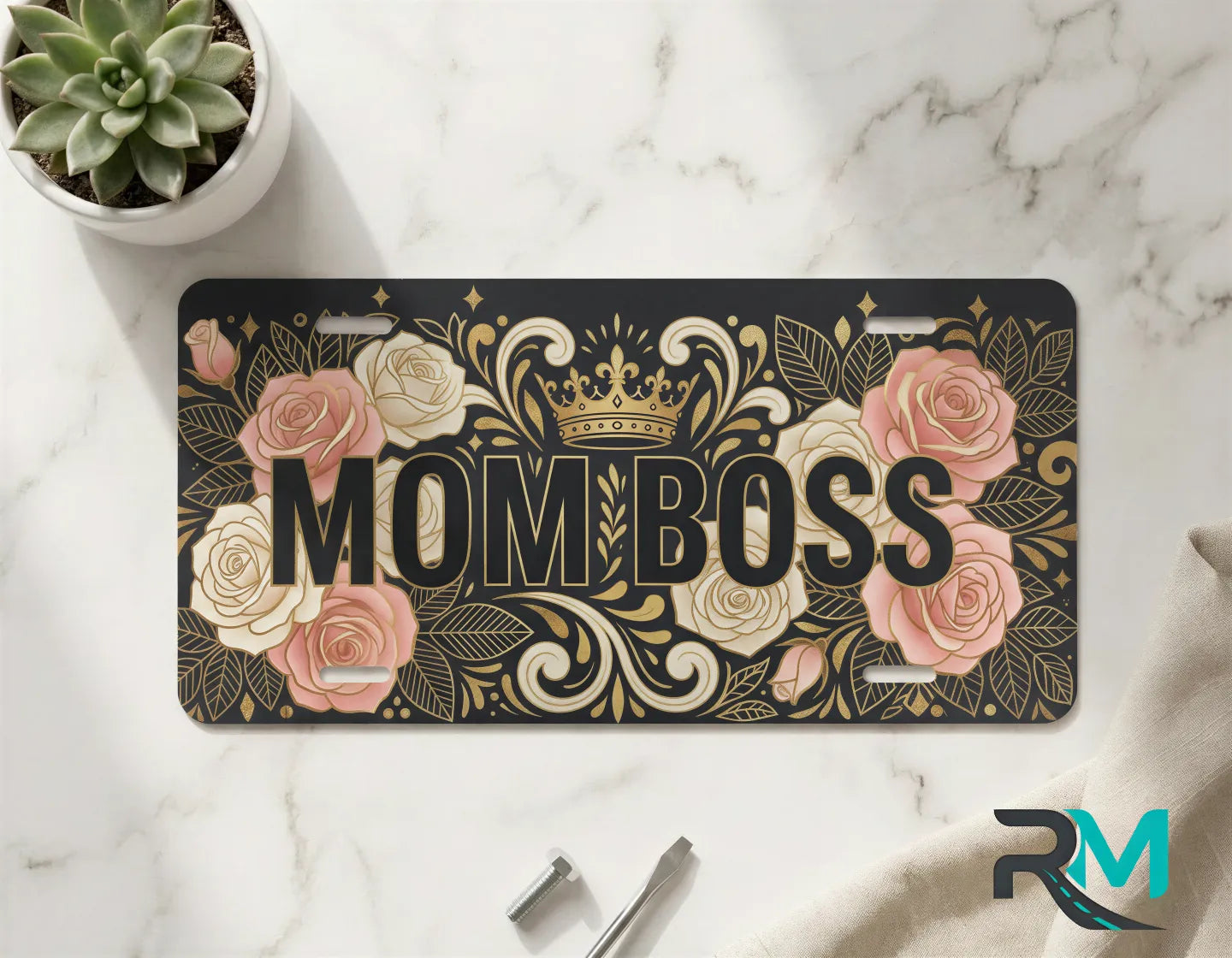 mom boss vanity plate on marble surface — blush rose gold decorative crown plate