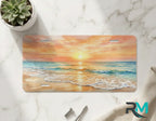 beach scene vanity plate on marble surface — warm gold pink coastal decorative license plate