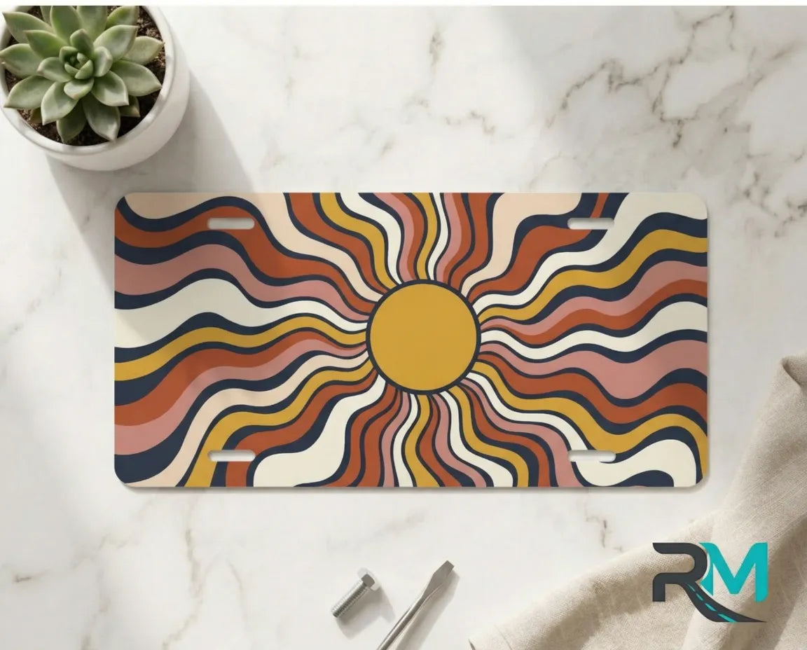 retro wavy sun vanity plate on marble surface — 70s earth tone decorative license plate