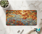 autumn maple stream vanity plate on marble surface — warm orange gold maple leaves river decorative plate
