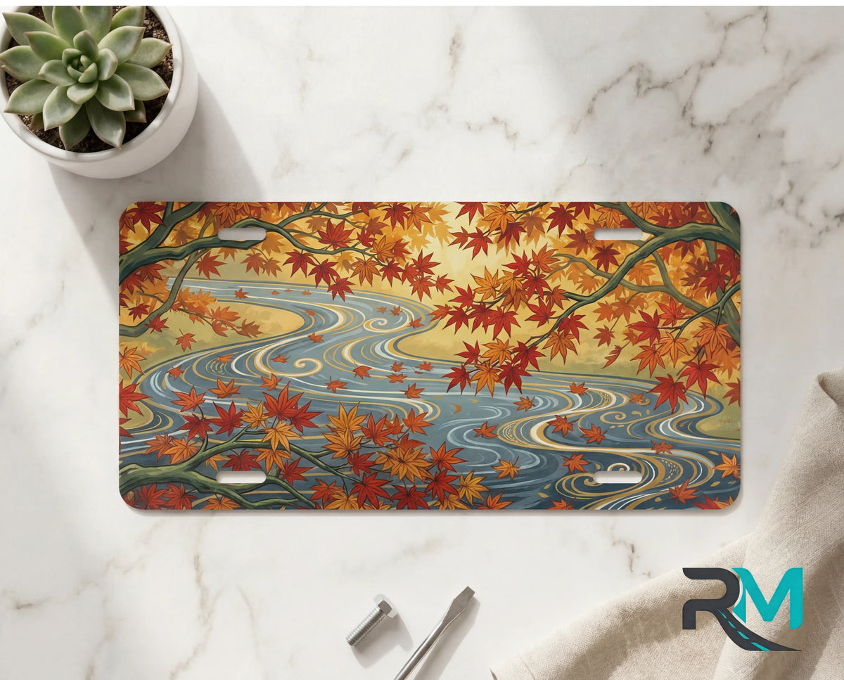 autumn maple stream vanity plate on marble surface — warm orange gold maple leaves river decorative plate