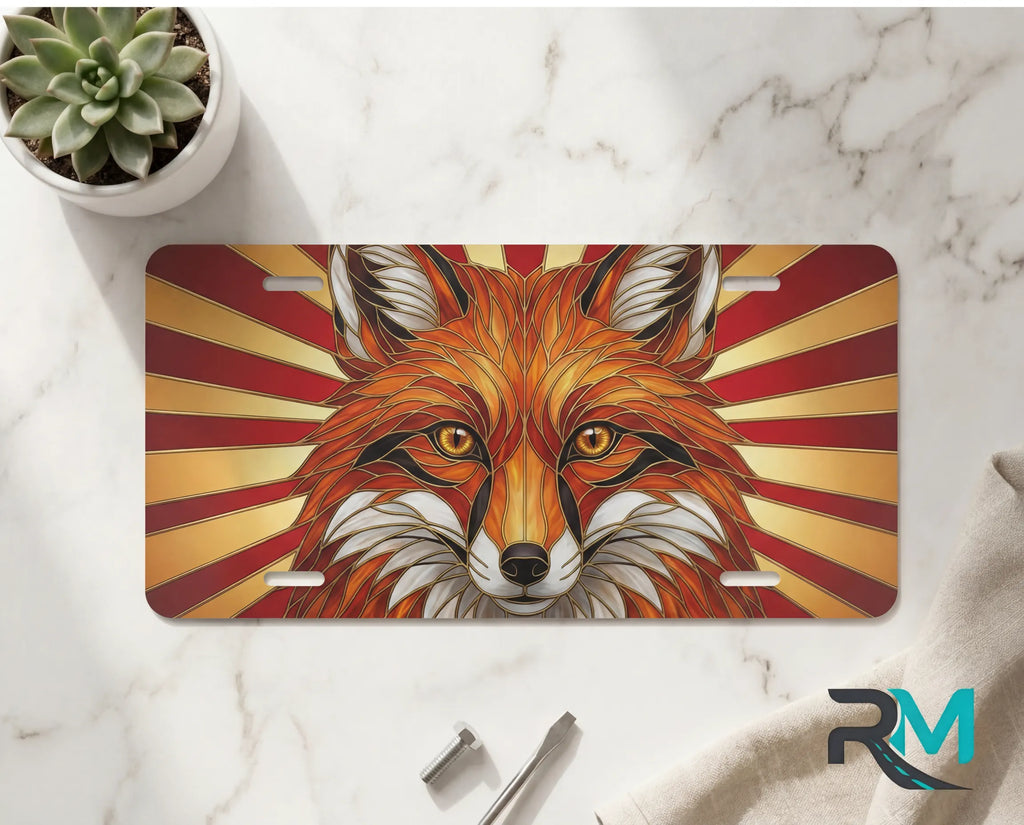red fox face vanity plate on marble surface — vivid red amber gold decorative wildlife plate