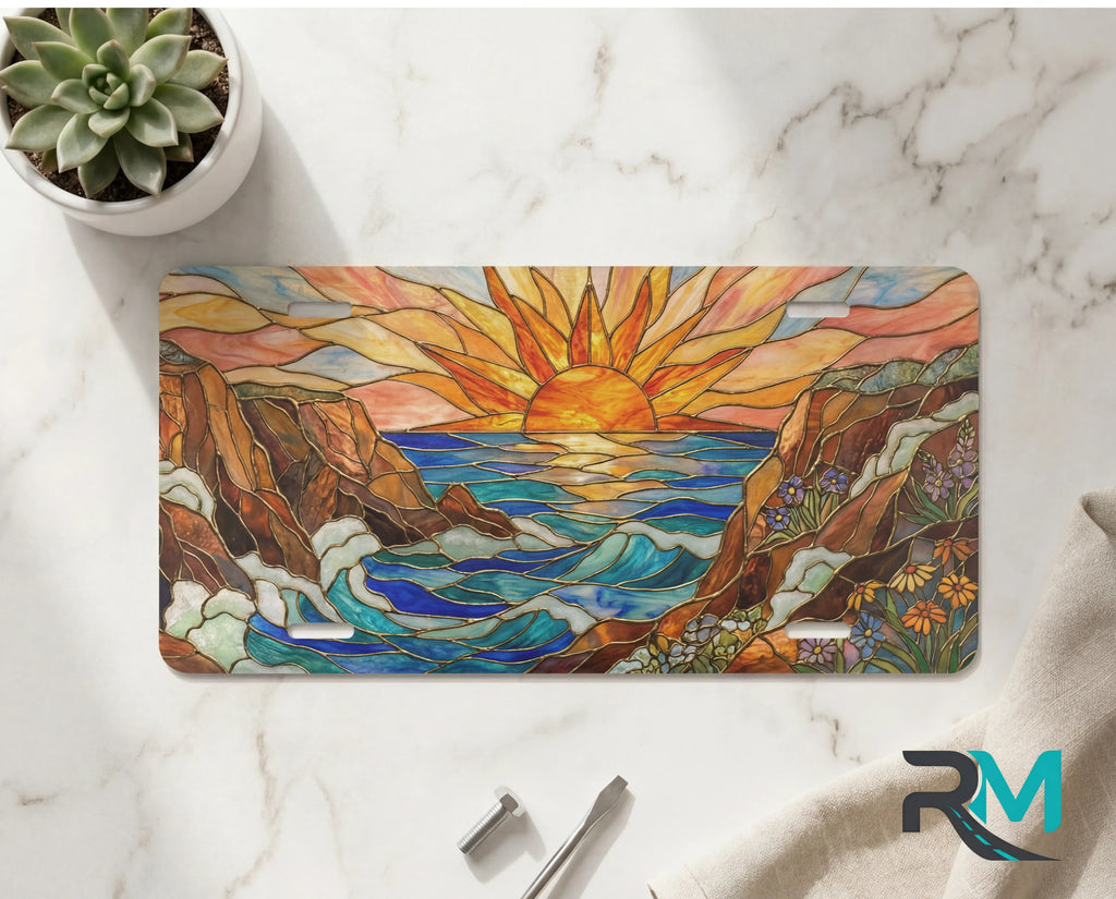 sunrise ocean cliffs vanity plate on marble surface — warm sunrise orange gold ocean cliffs decorative plate