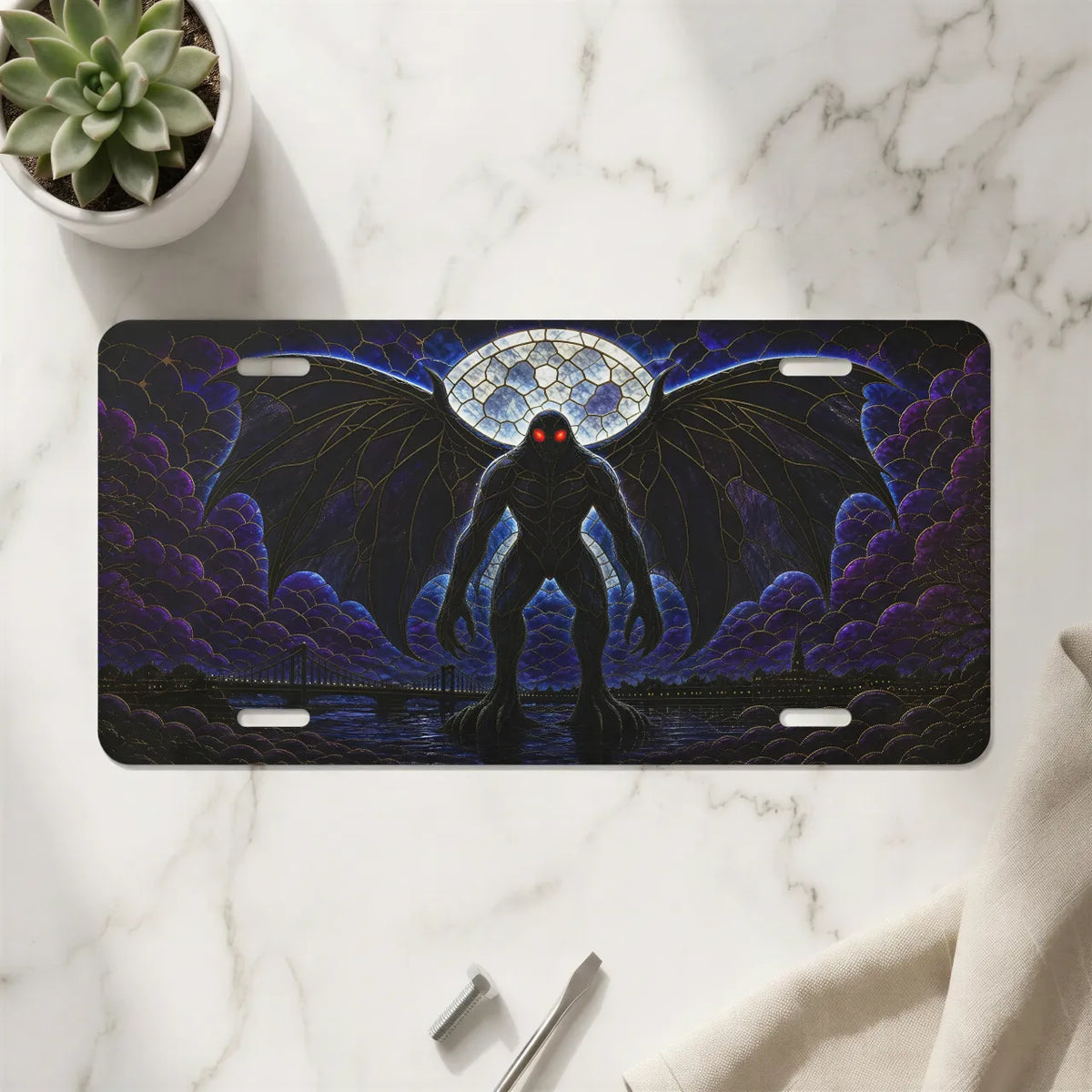 mothman vanity plate on marble surface — deep purple winged mothman red eyes decorative plate