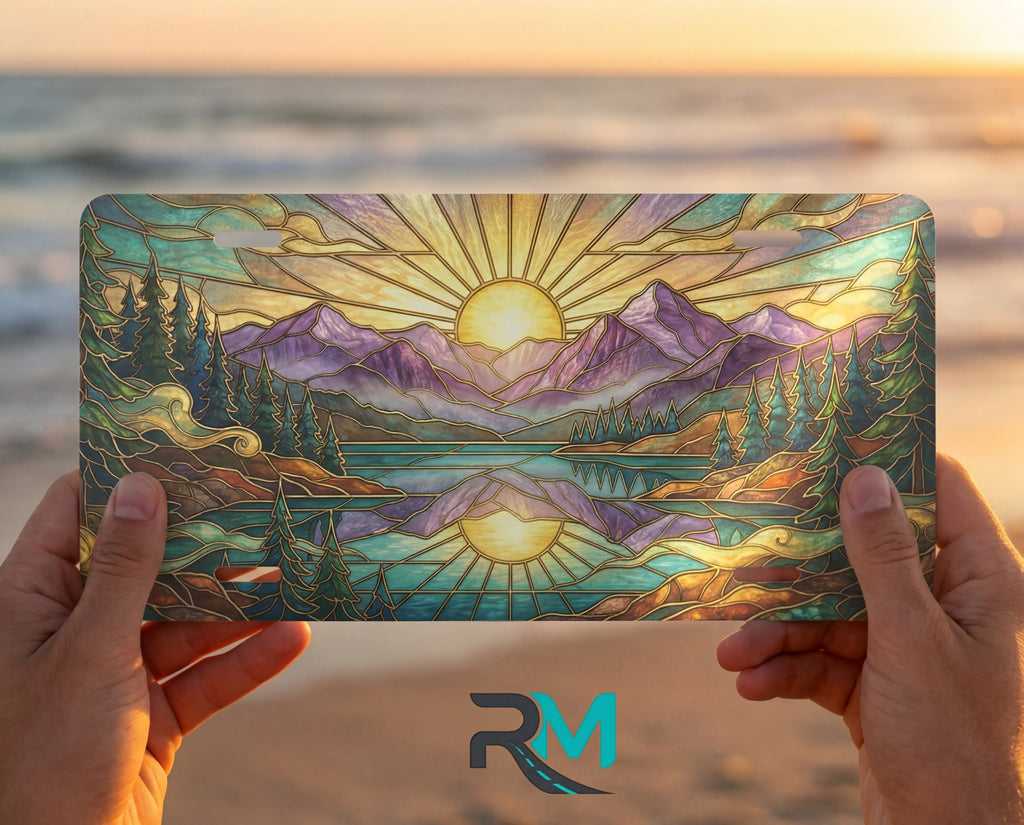 person showing sunrise mountain lake vanity plate — warm gold purple mountain lake front license plate