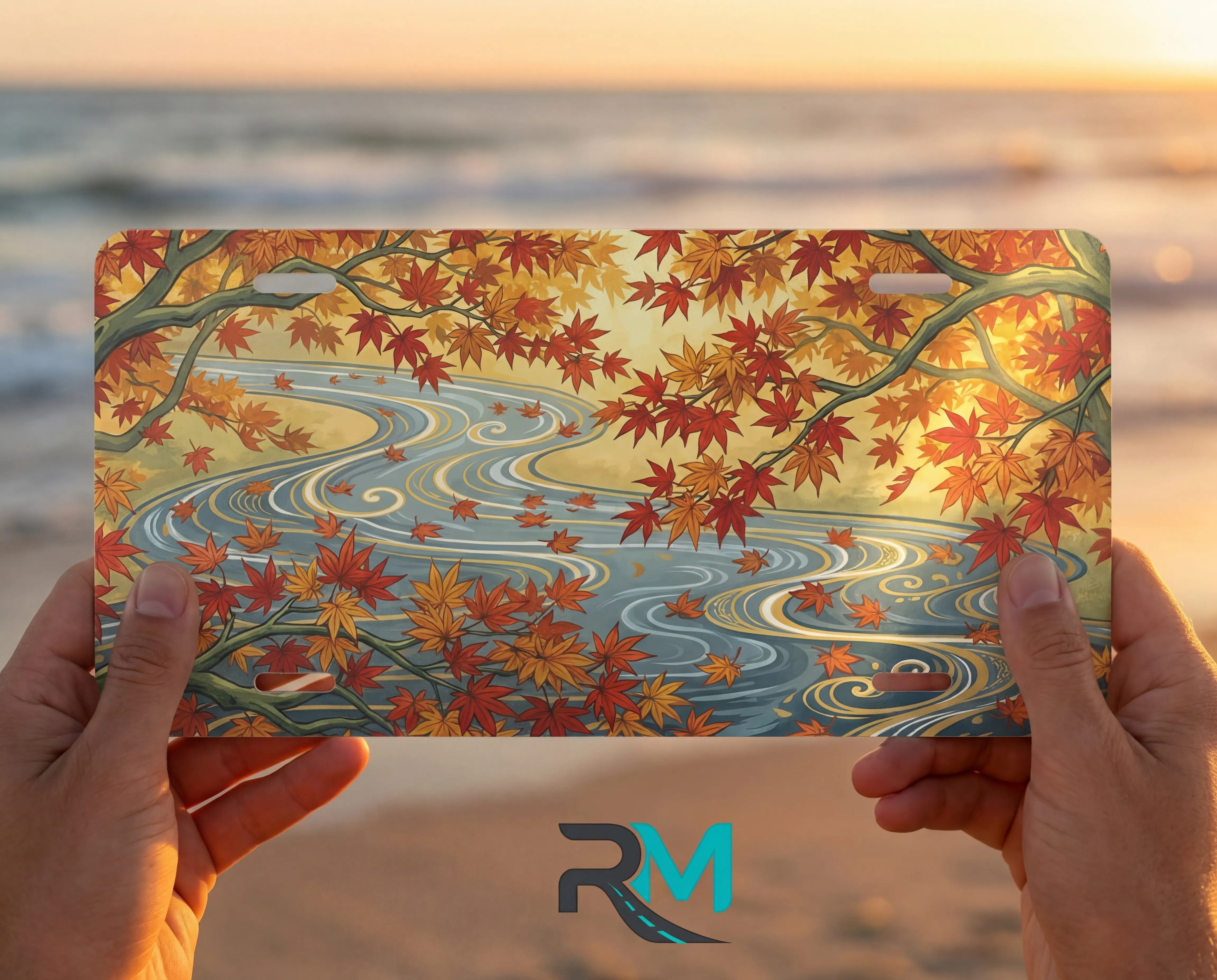 person showing autumn maple stream vanity plate — warm orange gold maple leaves river front license plate