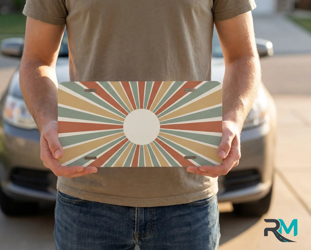 person holding retro vintage rays license plate — mid-century earth tone vanity plate art