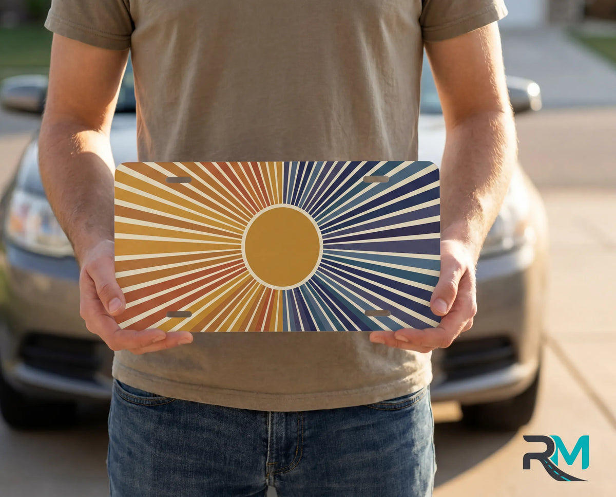 person holding retro indigo sunrise license plate — amber peach deep indigo vanity plate art