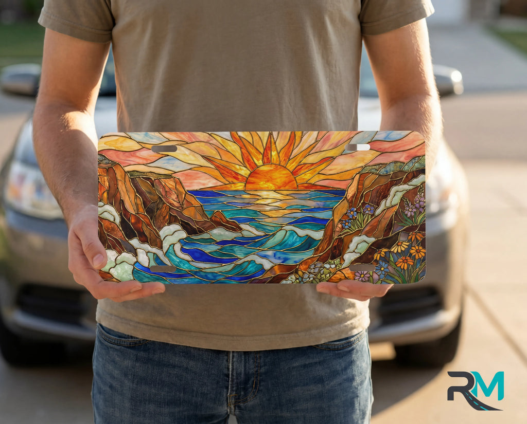 person showing sunrise ocean cliffs vanity plate — warm sunrise orange gold coastal front license plate