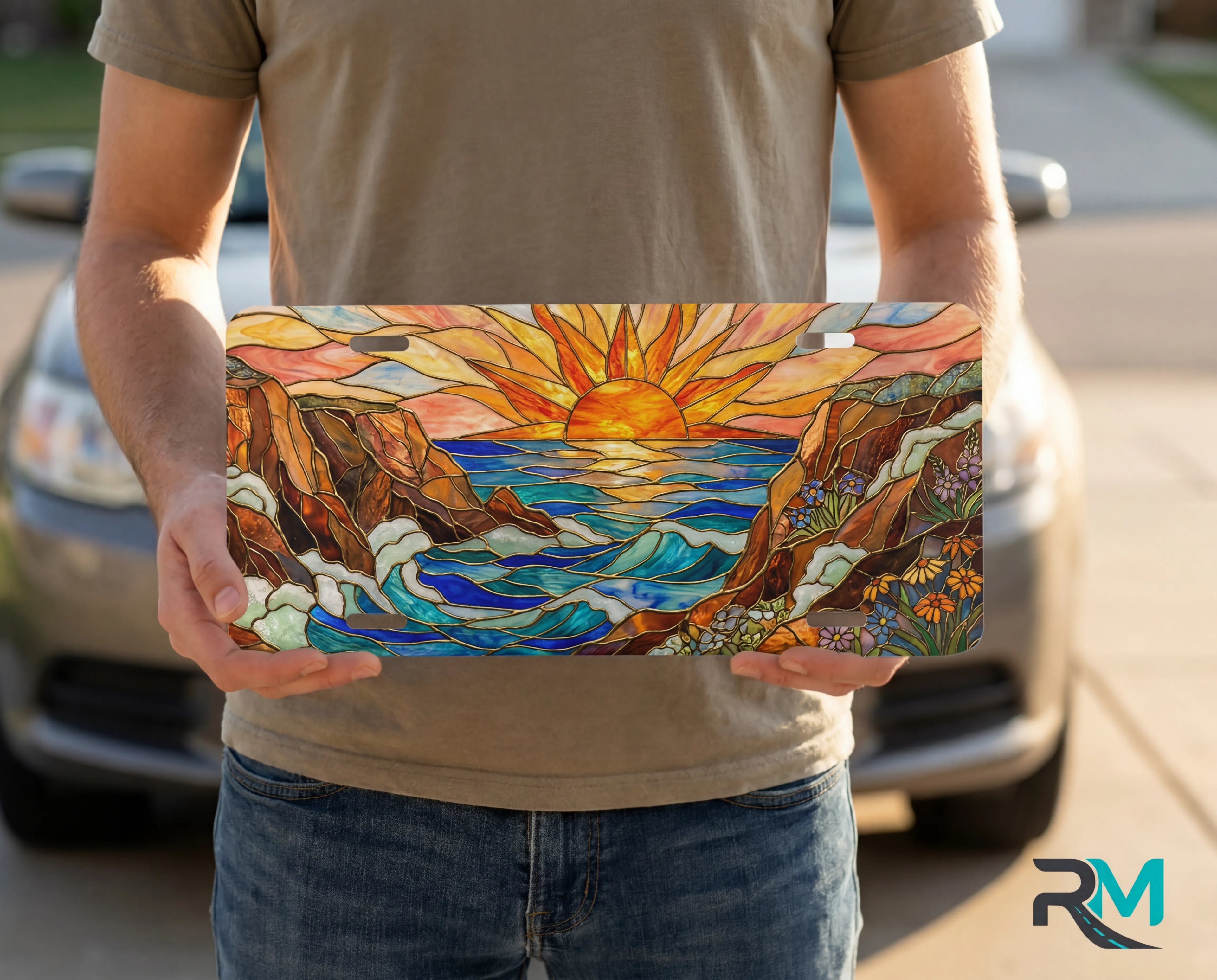 person showing sunrise ocean cliffs vanity plate — warm sunrise orange gold coastal front license plate