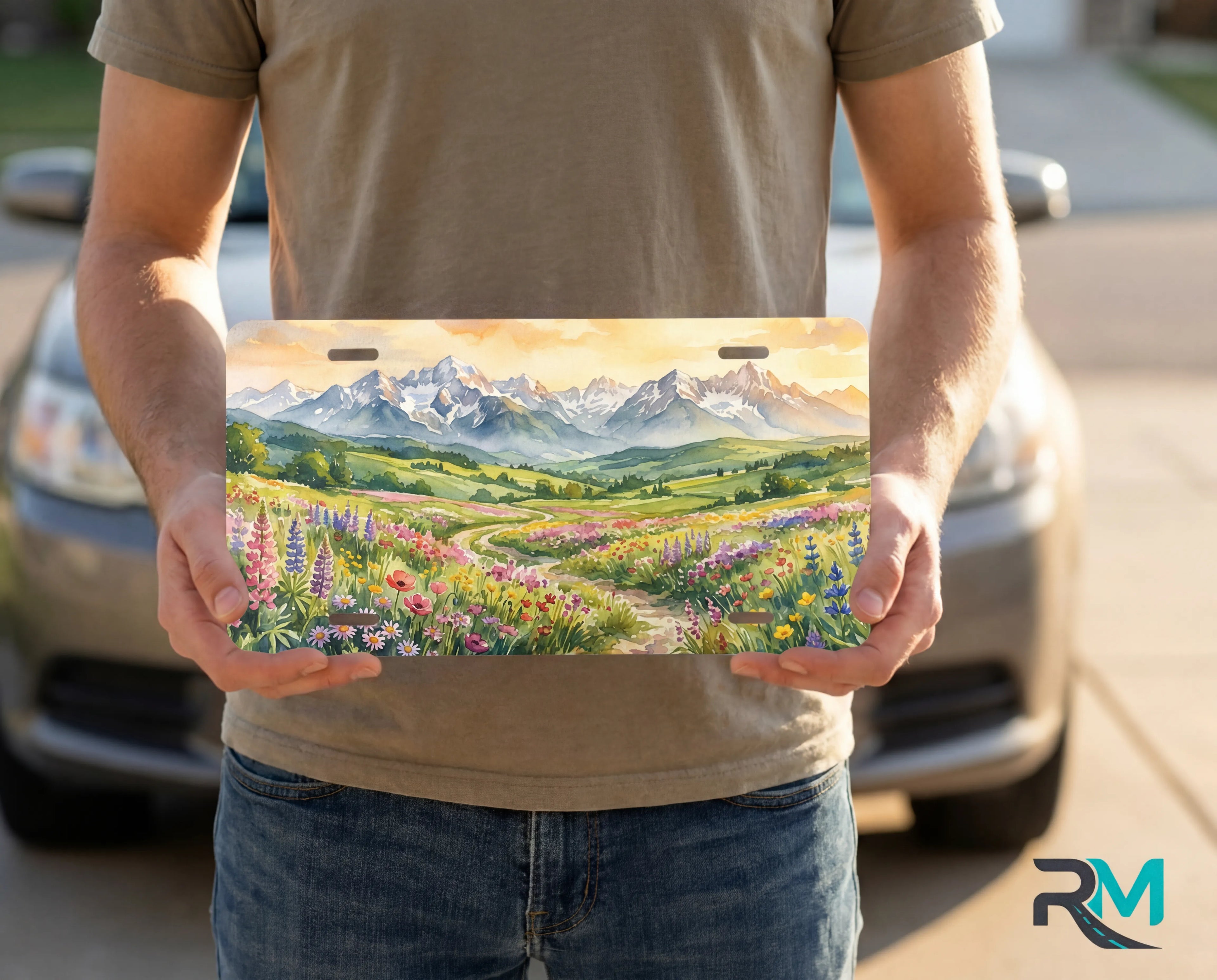 person holding wildflower mountain license plate — decorative alpine meadow vanity plate