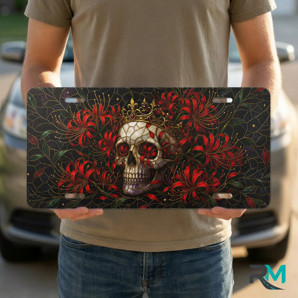 person holding skull crown vanity plate — jewel red crowned skull chrysanthemum front license plate