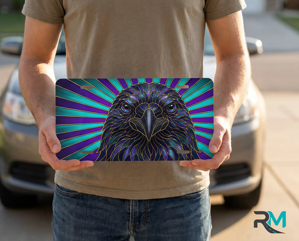 person holding raven head license plate — stained glass jewel-tone bird vanity plate art