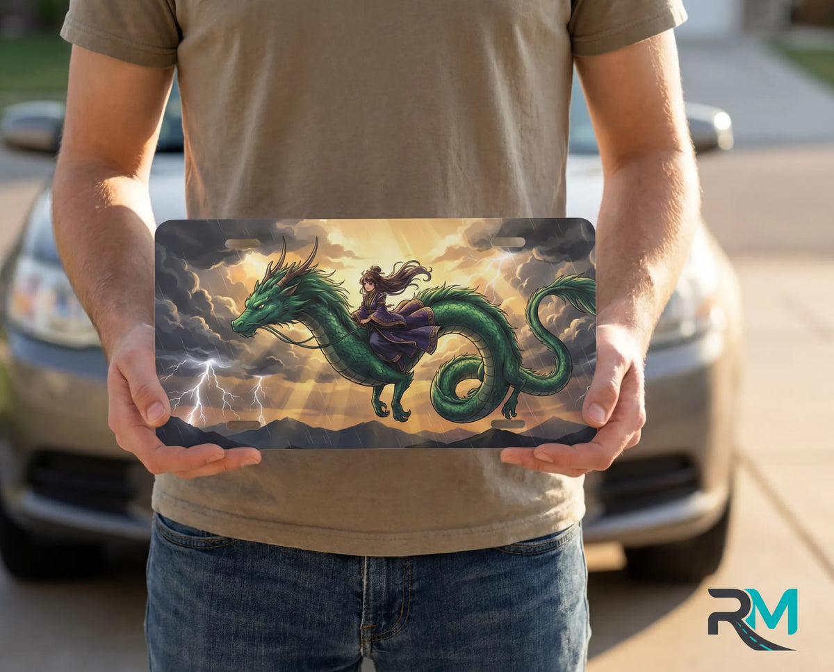 person showing emerald dragon rider vanity plate — rich emerald green dragon storm gold rider front license plate