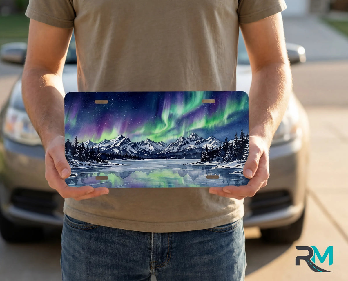 person holding northern lights license plate — aurora landscape vanity plate night sky art