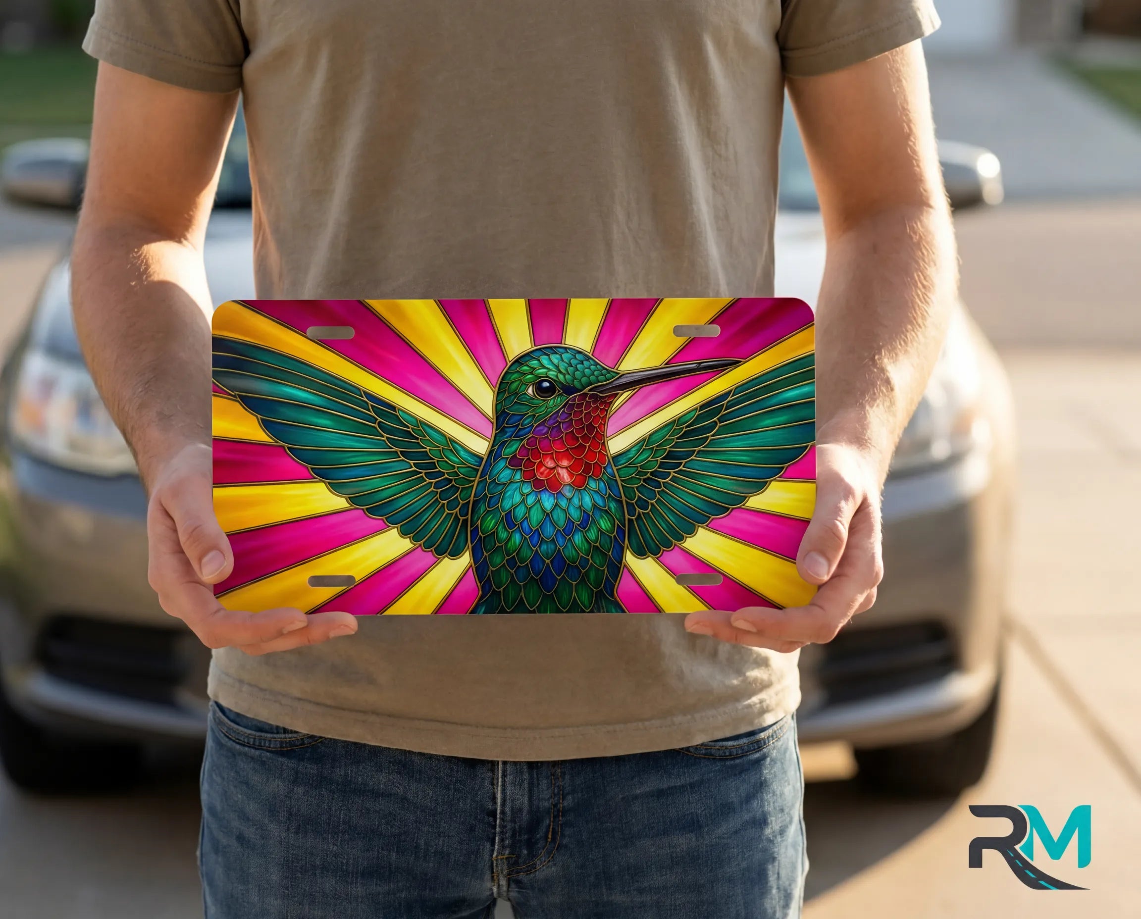 person holding hummingbird license plate — jewel-tone stained glass bird vanity plate art