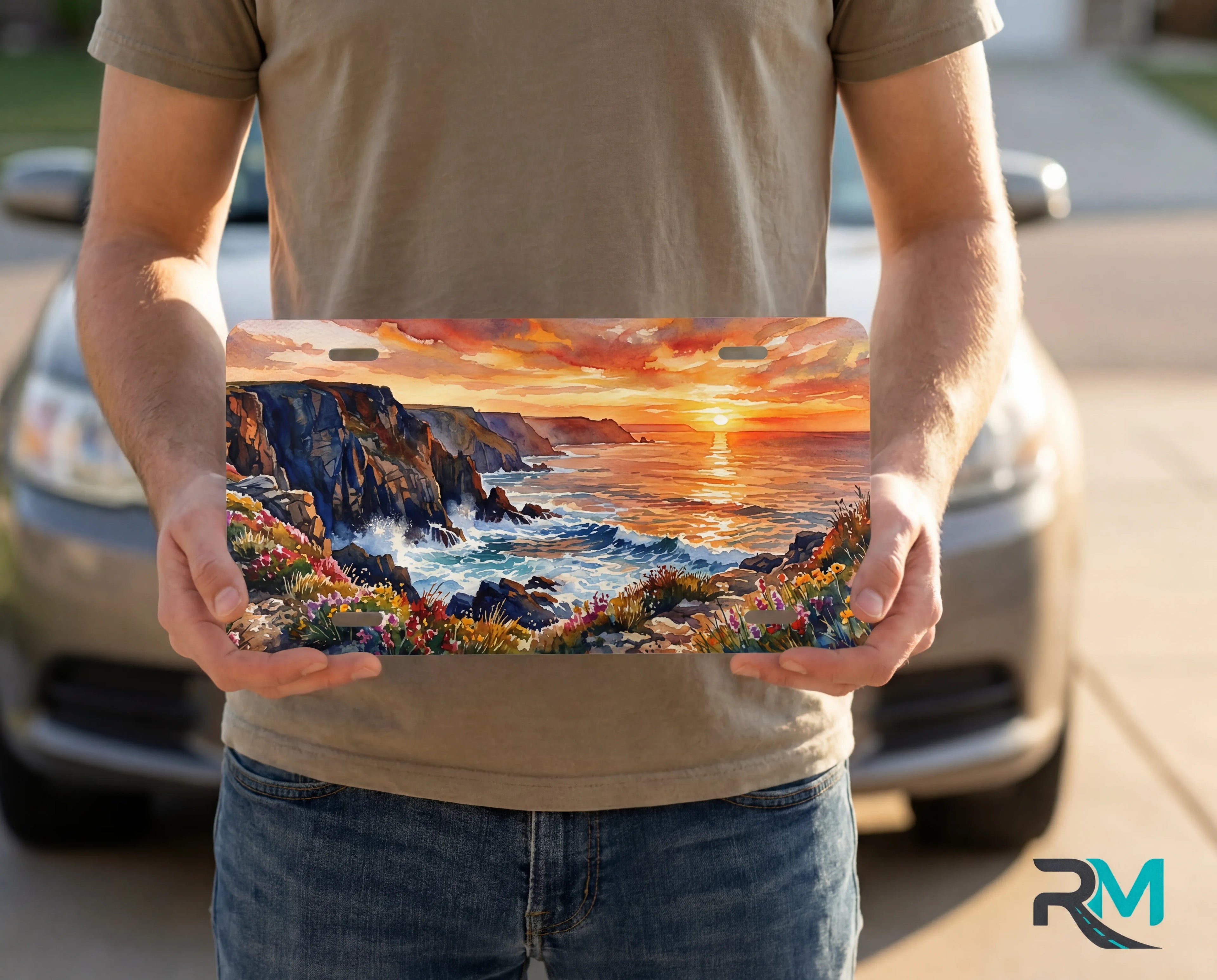 person holding ocean sunset license plate — coastal cliffs decorative vanity plate