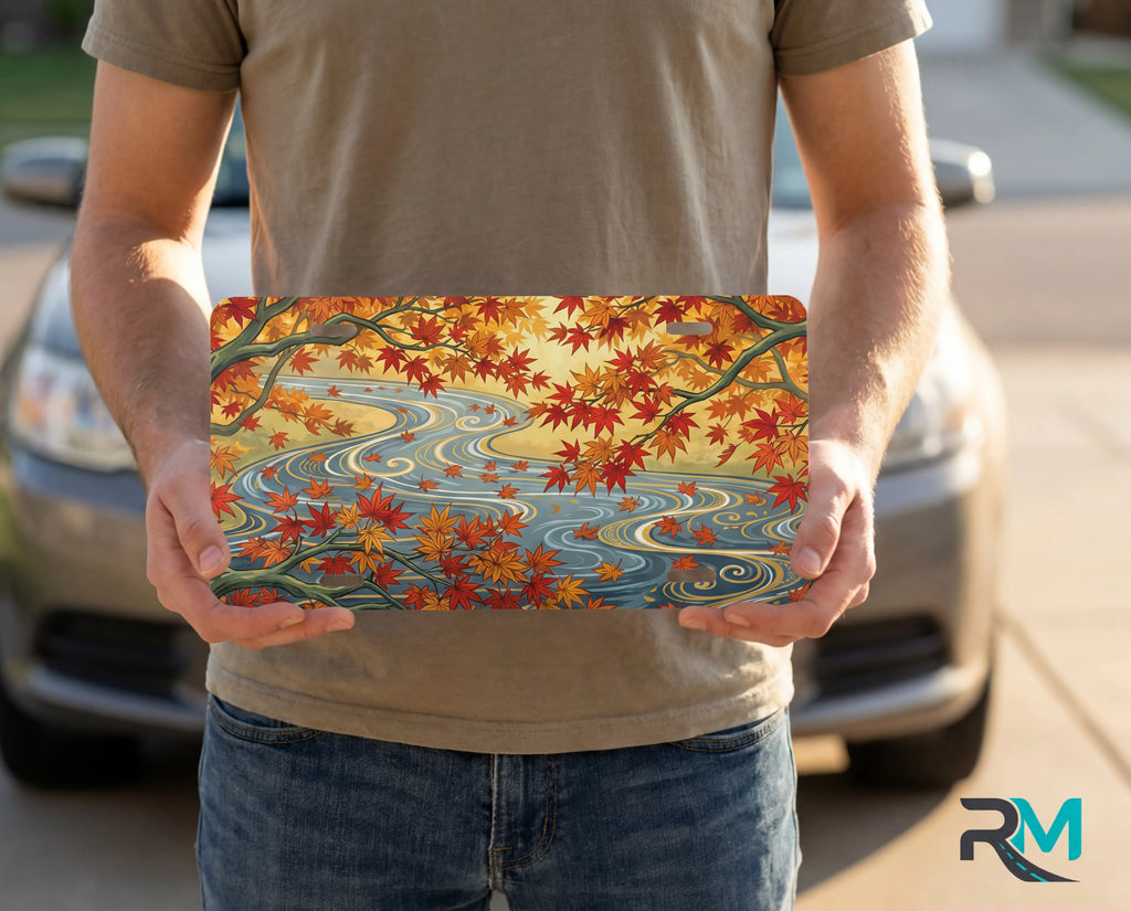 autumn maple stream vanity plate on display stand — warm orange gold maple leaves river aluminum plate