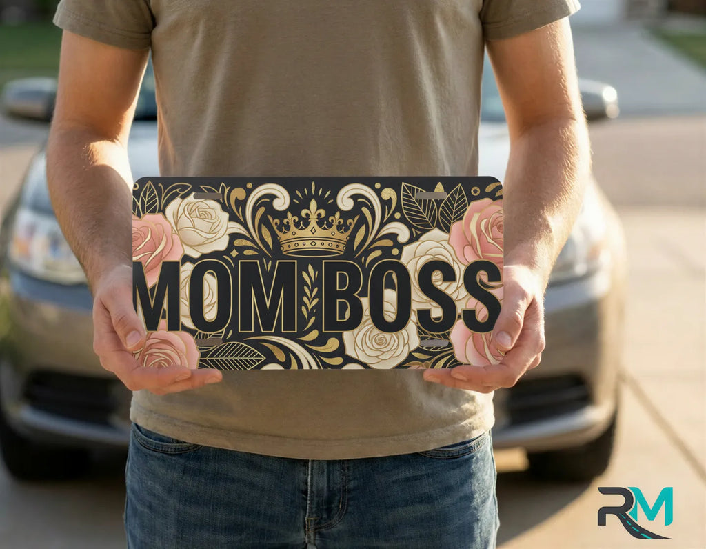 person holding mom boss license plate — floral crown vanity plate art
