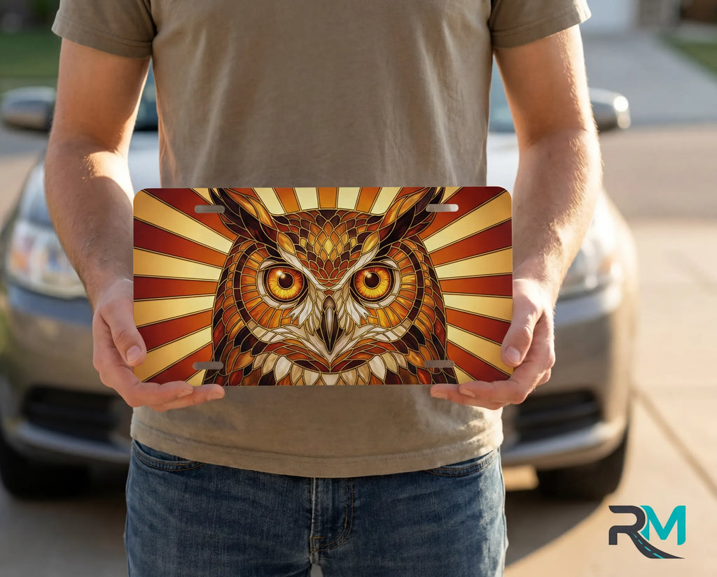 person holding owl illustration license plate — amber rust stained glass bird vanity plate art