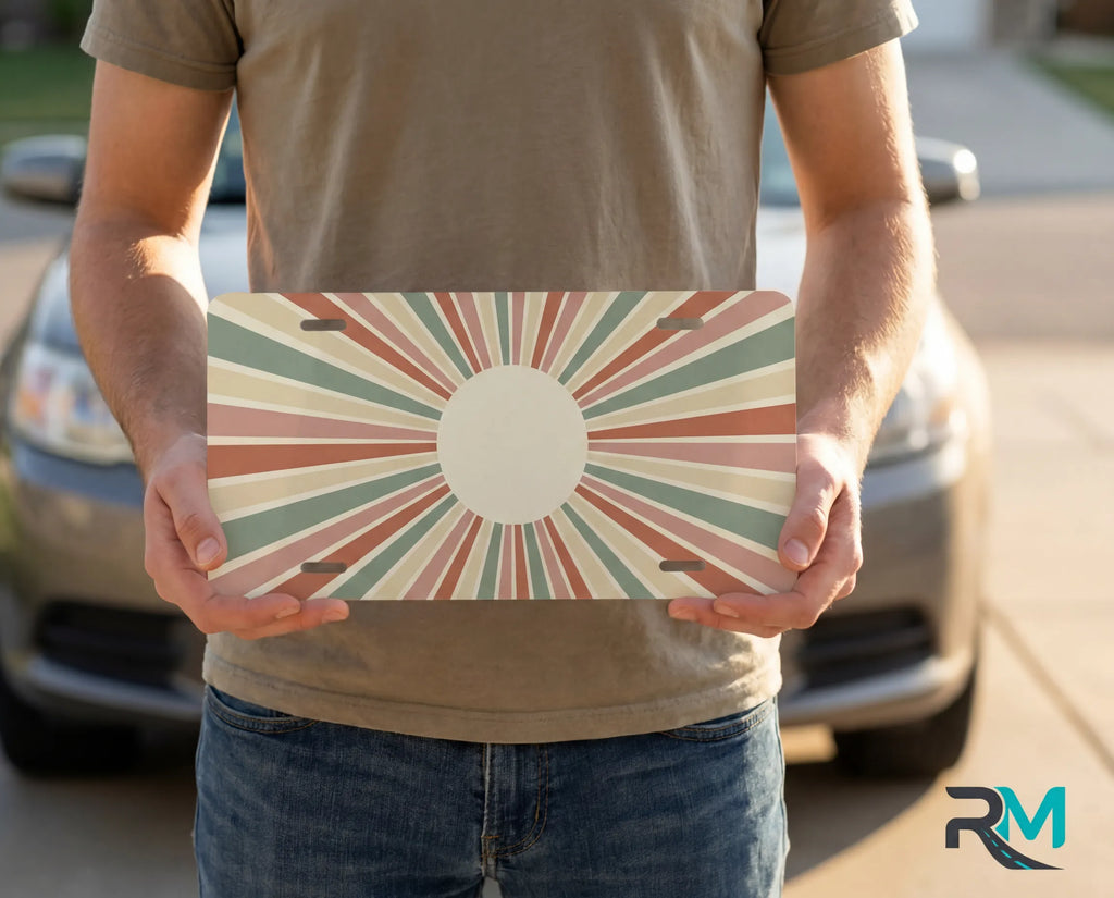 person holding retro sunburst monogram plate — earth tone circle vanity plate boho art