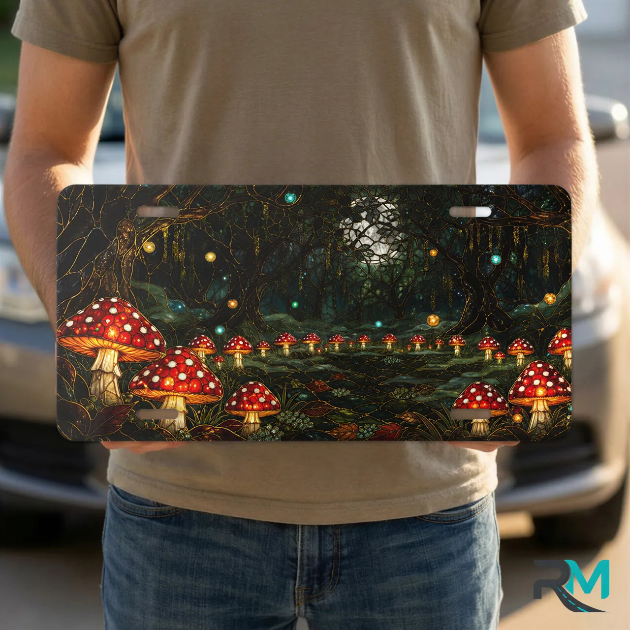 person holding enchanted mushroom forest vanity plate — glowing toadstool firefly front license plate