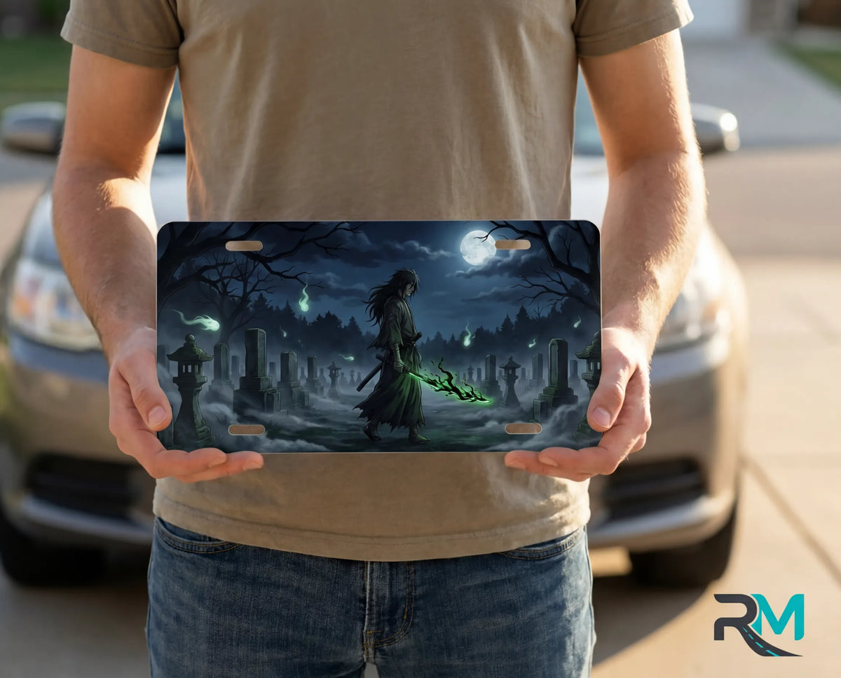 person showing grim reaper cemetery vanity plate — deep blue reaper spectral green front license plate