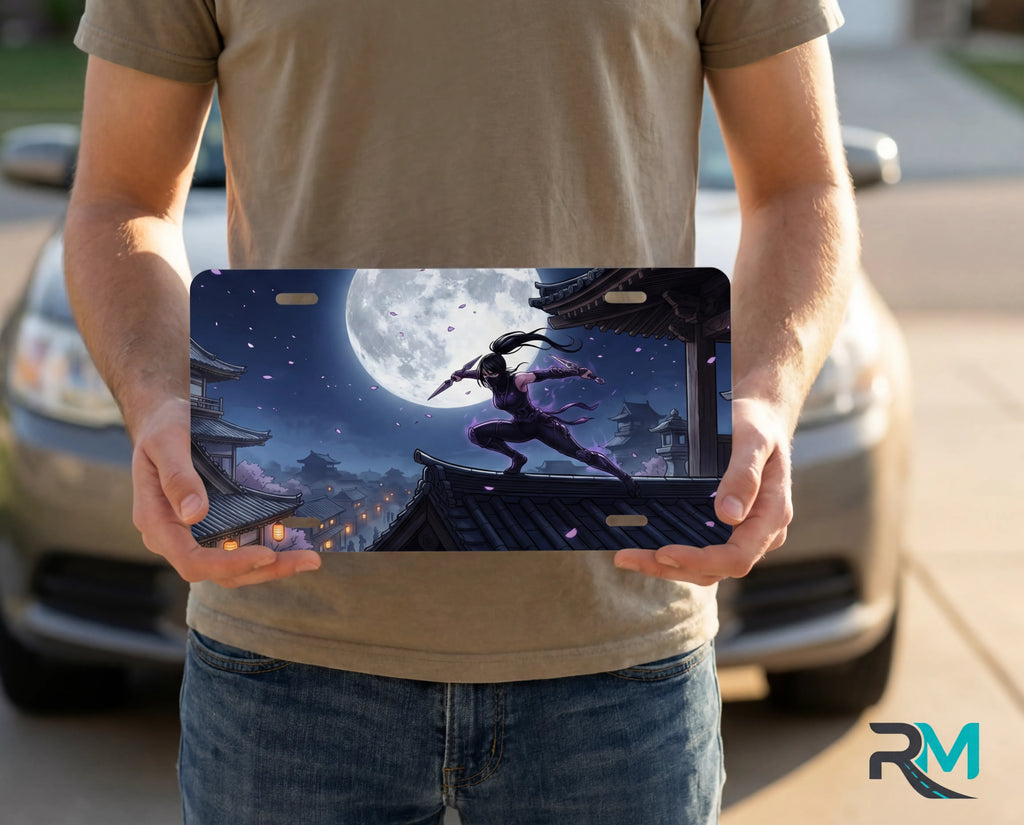 person showing moonlit ninja rooftop vanity plate — glowing moon midnight ninja front license plate