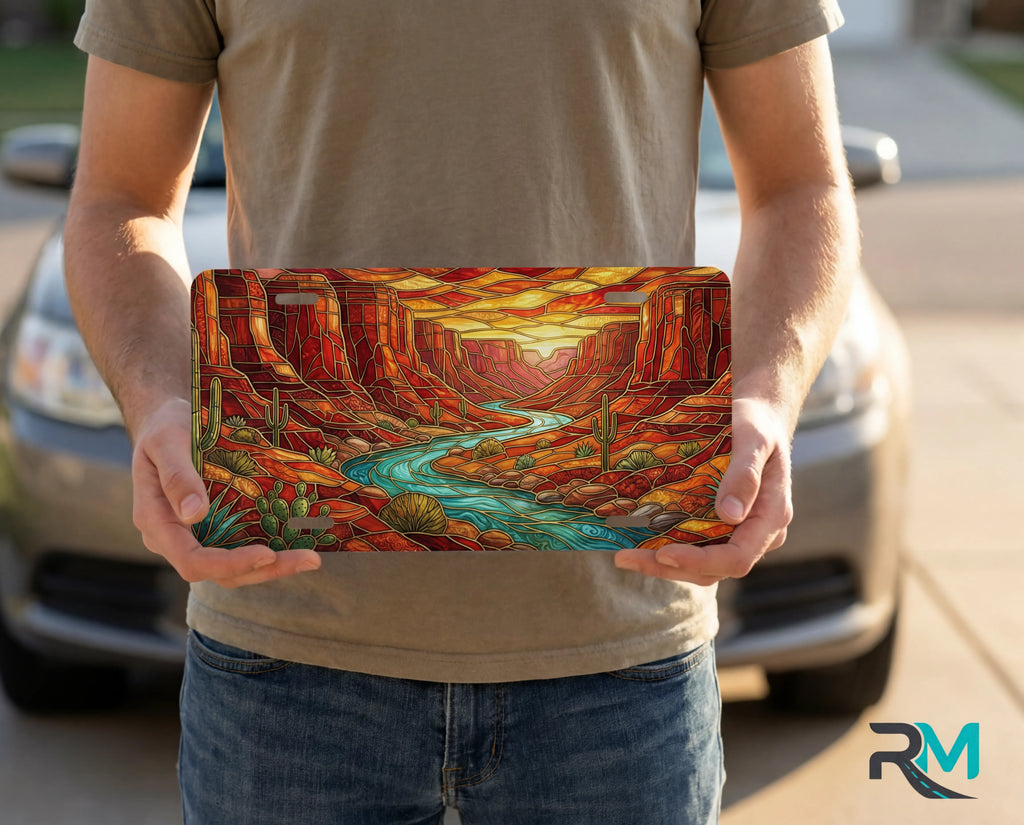 person showing desert canyon river vanity plate — turquoise creek red rock canyon molten sunset front license plate