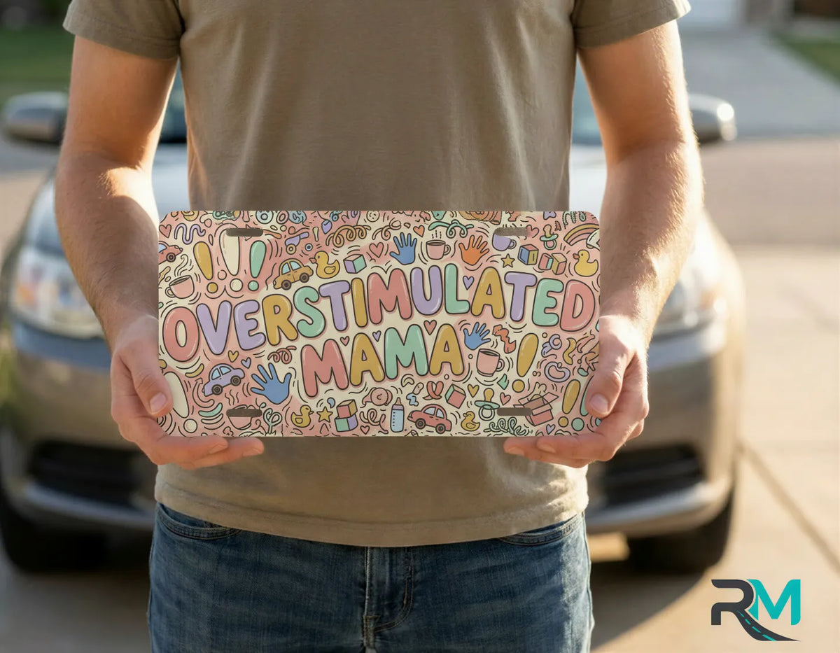 person holding overstimulated mama license plate — colorful pastel doodle vanity plate art