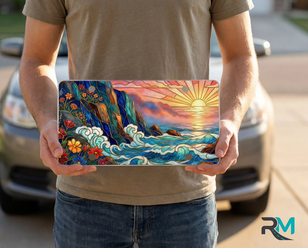 person showing sunset ocean waves vanity plate — warm gold jewel teal sunrise ocean coastal front license plate