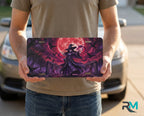 person showing witch silhouette vanity plate — jewel purple witch blood-red moon front license plate