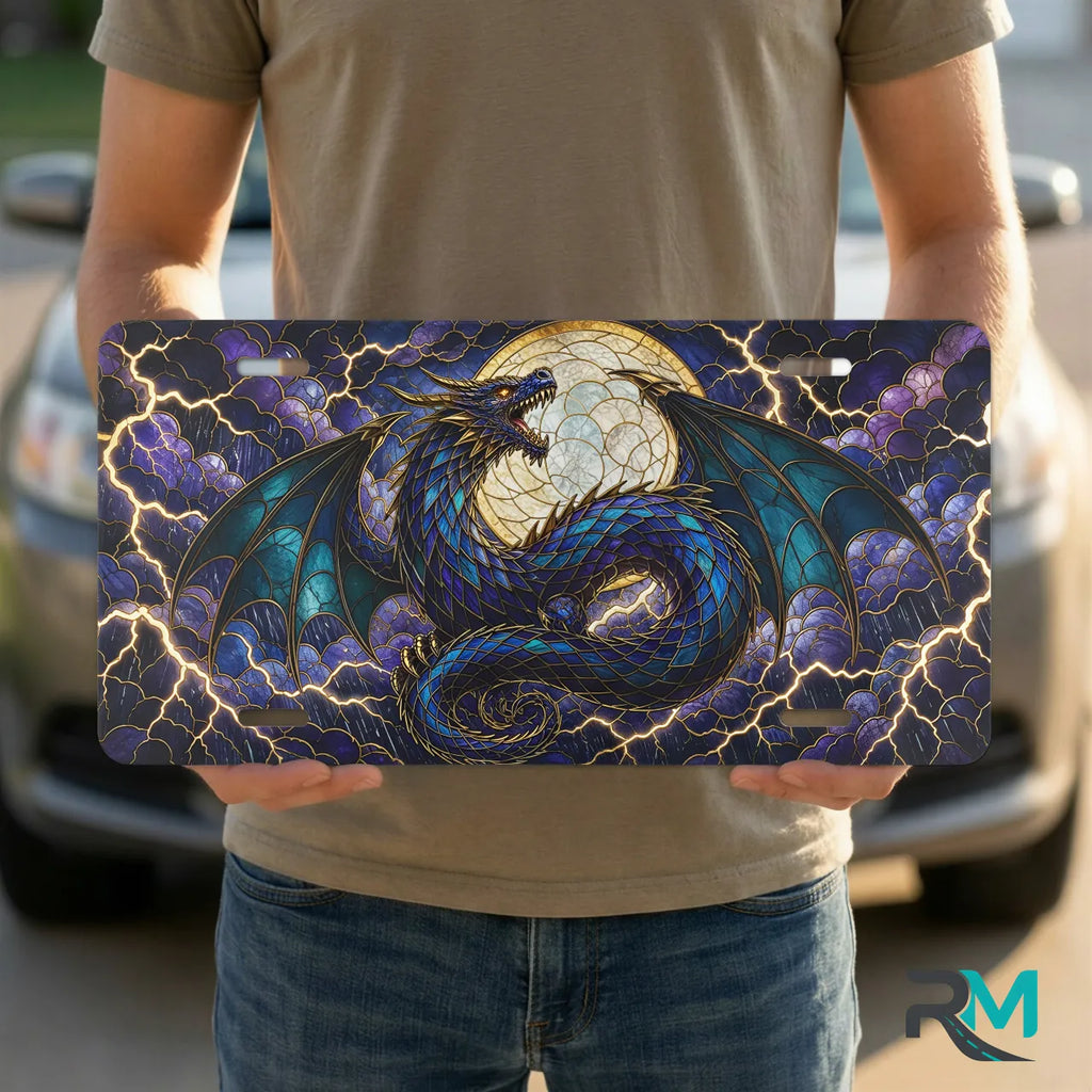 person holding blue dragon vanity plate — jewel blue teal coiled dragon moon front plate