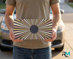 person holding retro striped sunburst license plate — bold cream mustard vanity plate