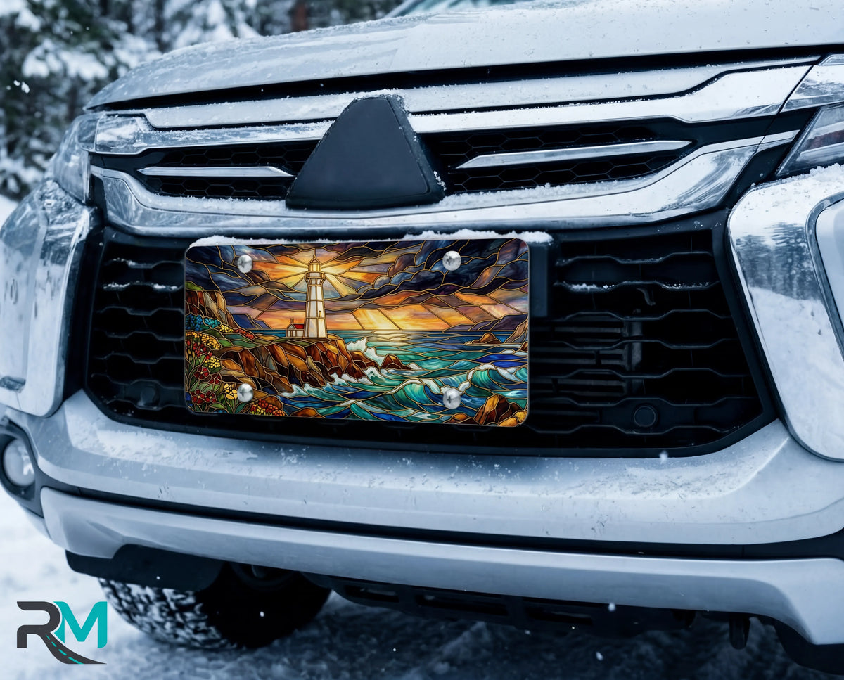 lighthouse seascape vanity plate on car in snowy setting — vivid coastal blue lighthouse crashing waves design
