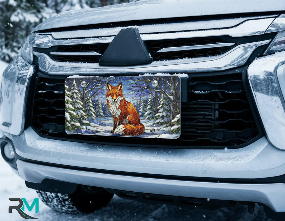 fox snowy forest license plate on car in snowy setting — warm amber winter fox design