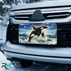 orca whale vanity plate on car in snowy setting — vivid orca icy blue ocean wave design