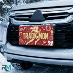 track mom license plate on car in snowy setting — runner silhouette track sports design