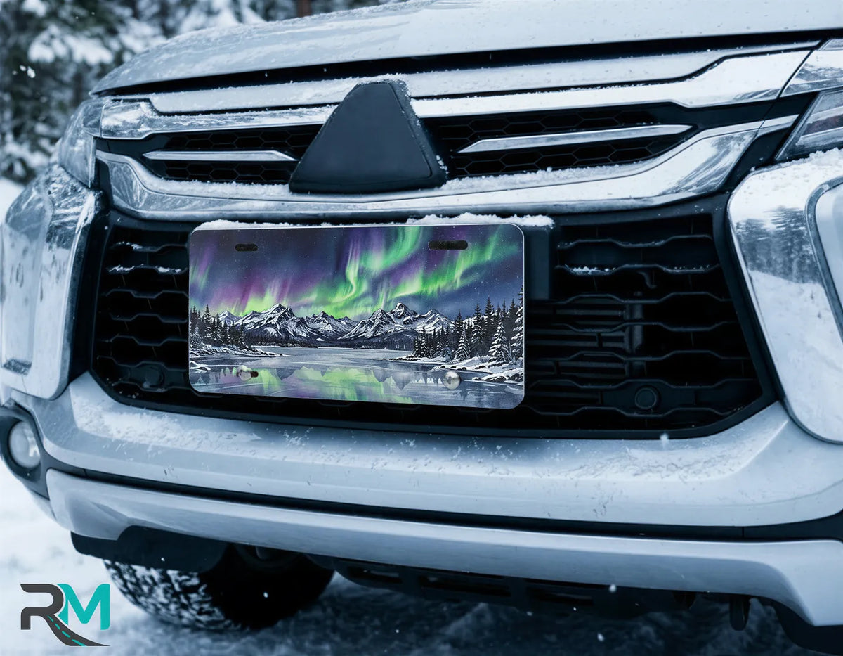 aurora borealis license plate on car in snowy setting — northern lights mountain scene design