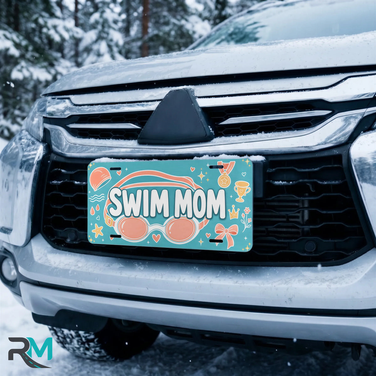 swim mom license plate on car in snowy setting — teal coral goggles swim design