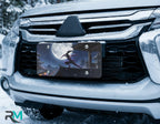 moonlit ninja vanity plate on car in snowy setting — glowing moon midnight ninja cherry blossoms design