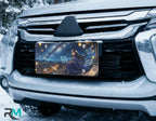 starry night girl vanity plate on car in snowy setting — deep blue night rooftop lanterns starry design