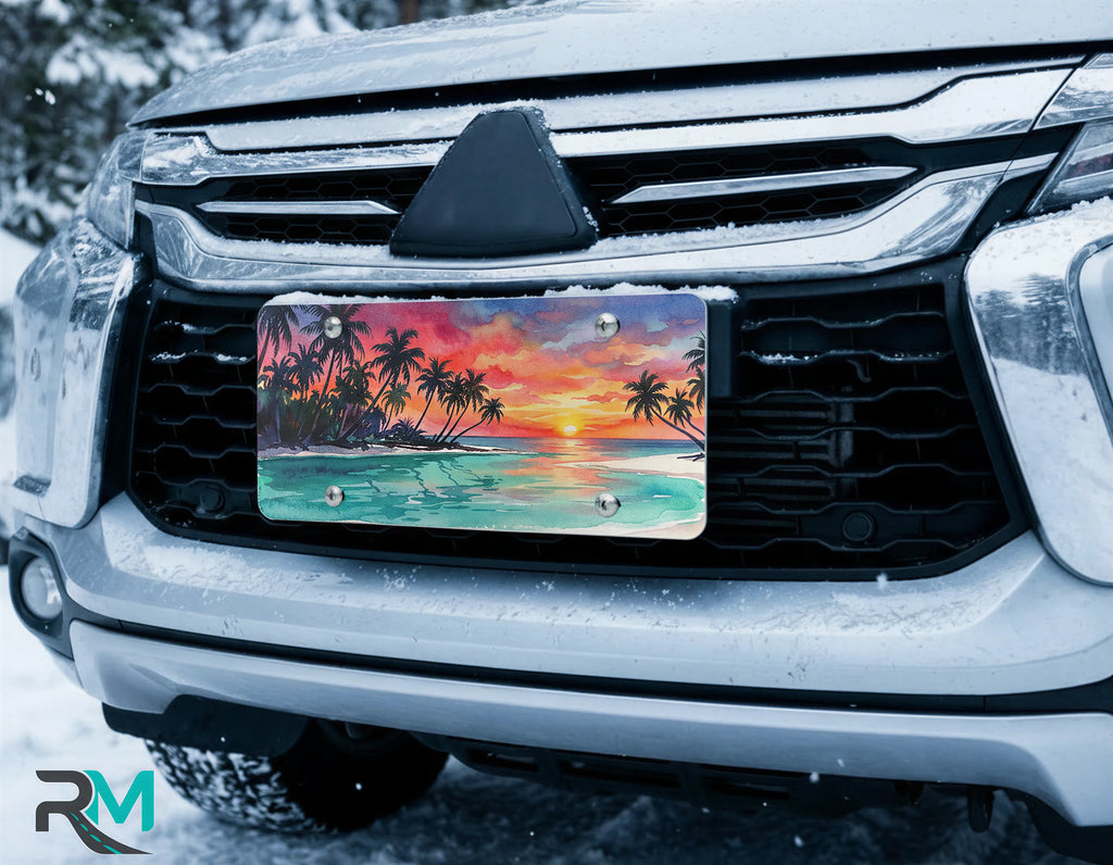 scenic beach license plate on car in snowy setting — tropical palm sunset watercolor design