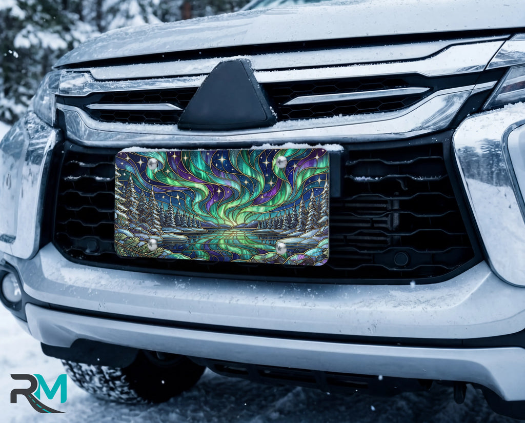 northern lights lake scene vanity plate on car in snowy setting — jewel teal purple aurora pine frozen lake design