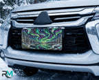 northern lights lake scene vanity plate on car in snowy setting — jewel teal purple aurora pine frozen lake design