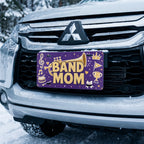 band mom license plate on car in snowy setting — musical notes marching band design