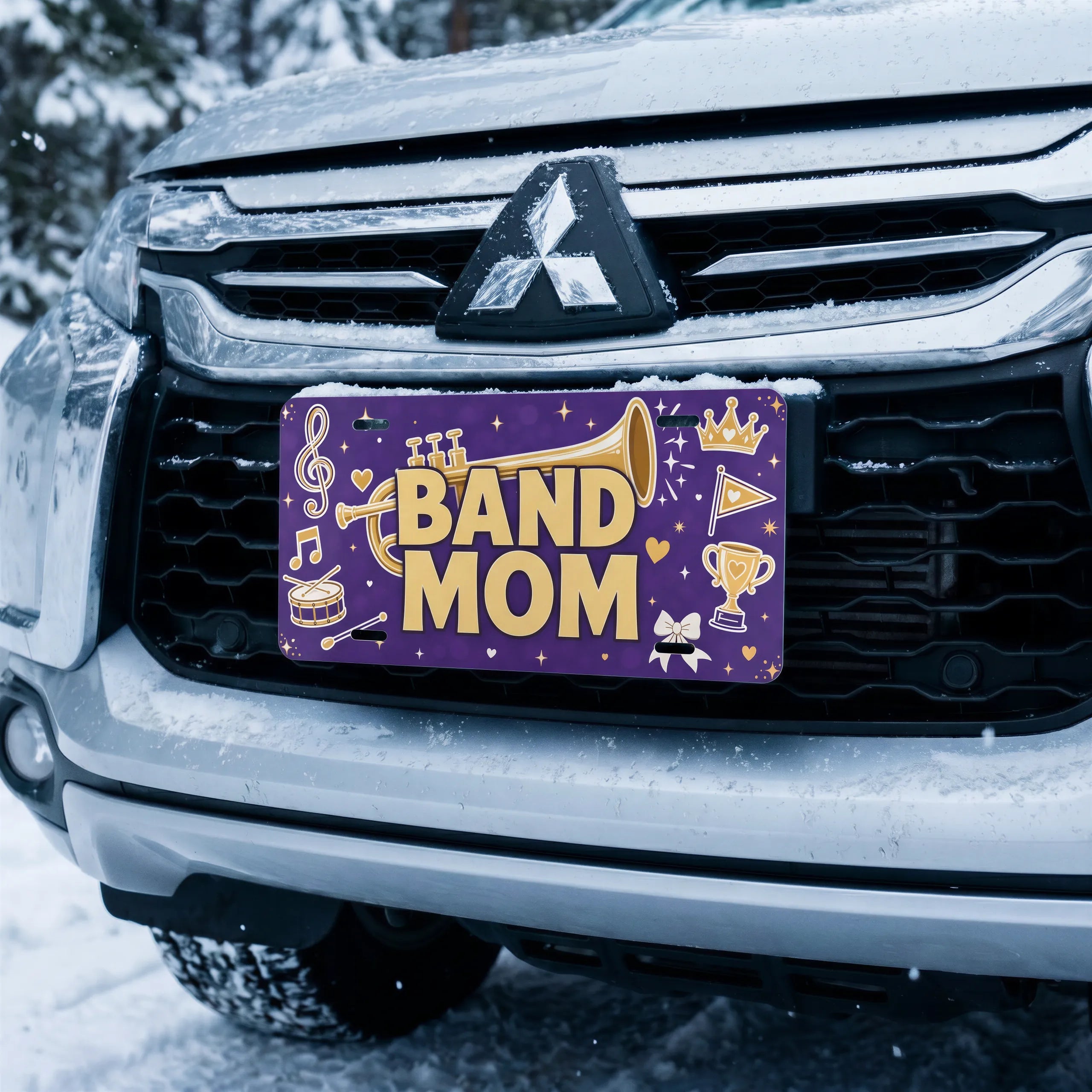 band mom license plate on car in snowy setting — musical notes marching band design